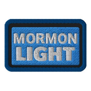 May include: Embroidered patch with the words "MORMON LIGHT" in white thread on a blue denim background. The patch has a black border and a blue stitched edge.