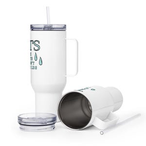 May include: White travel mug with a black handle and a blue and white graphic that says "It's the little things that don't make sense" with two blue raindrops. The mug has a lid and a straw.