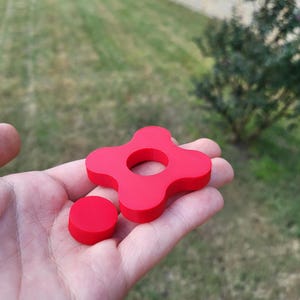 Simplistic red fidget spinner with removable center