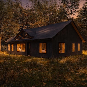 Warm black cottage exterior at sunset showing a 2 bedroom 2 bathroom 1200 sqft modern cabin house design with glowing interior lights, forest surroundings, stone pathway, and soft landscape lighting.