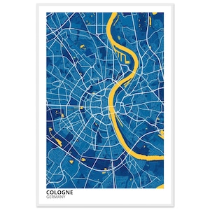 Puede incluir: Un mapa enmarcado de Colonia, Alemania. El mapa presenta un fondo azul con calles blancas y un río amarillo. El nombre de la ciudad y el país están impresos en blanco en la parte inferior.
