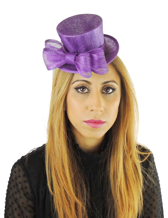 plum coloured hats and fascinators
