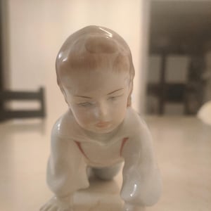 Porcelain figurine &quot;Crawling boy&quot;. Manufactured by ZSOLNAY (Hungary)