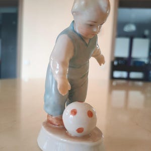 Porcelain figurine &quot;Boy football player&quot;.  Manufactured by ZSOLNAY (Hungary)