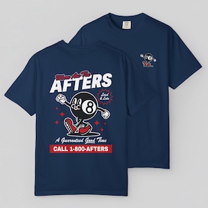 May include: Two navy blue t-shirts. One has a cartoon eight-ball character with the text "Where Are The AFTERS" and "A Guaranteed Good Time". The other shirt has a smaller graphic of the eight-ball. The shirts are made of a soft material.