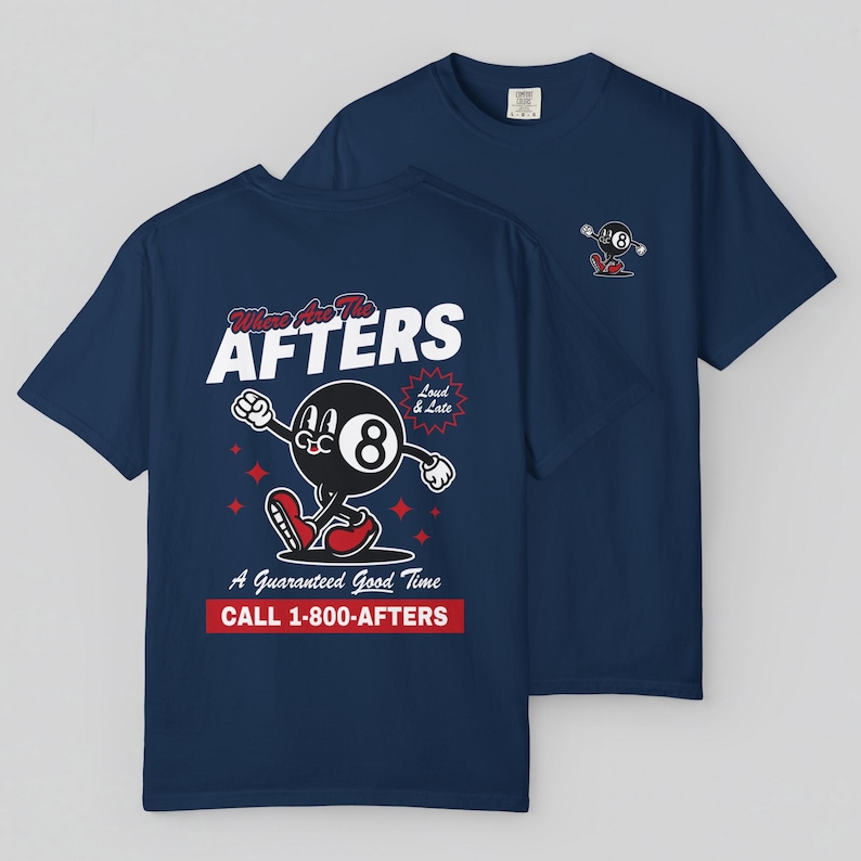 May include: Two navy blue t-shirts. One has a cartoon eight-ball character with the text "Where Are The AFTERS" and "A Guaranteed Good Time". The other shirt has a smaller graphic of the eight-ball. The shirts are made of a soft material.