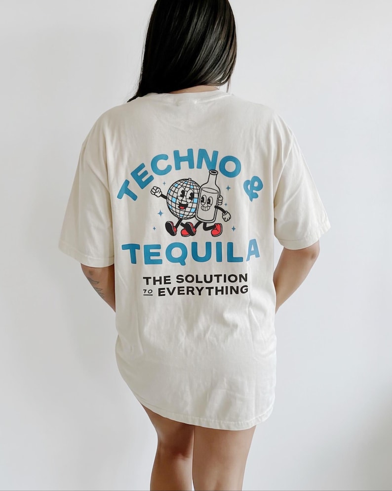 May include: Cream-colored t-shirt with the words "TECHNO & TEQUILA" in blue, along with a cartoon graphic of a disco ball and a tequila bottle. The text "THE SOLUTION TO EVERYTHING" is printed below the main text.