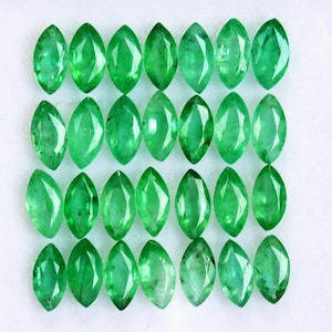 May include: Twenty-five emerald green faceted gemstones arranged in four rows. The gemstones are all the same size and shape, and they are set in a white background.