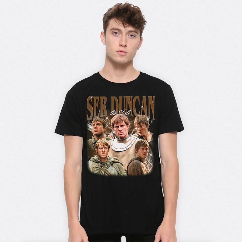 May include: Black t-shirt featuring a vintage-style graphic of a man and the text "Ser Duncan the Tall". The graphic includes multiple images of the same man in various poses. The shirt is a classic crew neck.