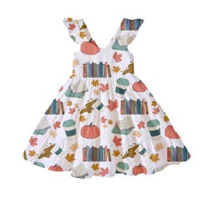Dress product example with seamless print with books, pumpkins, coffee, and fall leaves