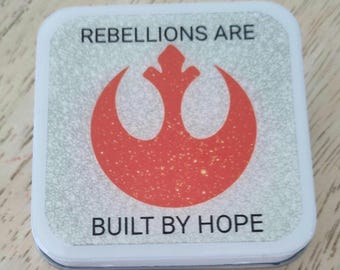 Notions Tin: Rebellions Are Built By Hope Resin-Coated Flip Top Square Box Knitting Craft Supplies