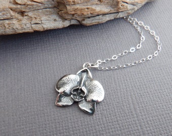 sterling silver orchid flower necklace. small floral pendant. petite dainty bloom charm. delicate blossom charm botanical jewelry gift 5/8"