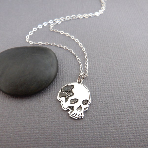 sterling silver flat skull necklace small hollowed eyes tiny Halloween charm simple jewelry delicate petite pendant spooky ghoul gift 1/2"