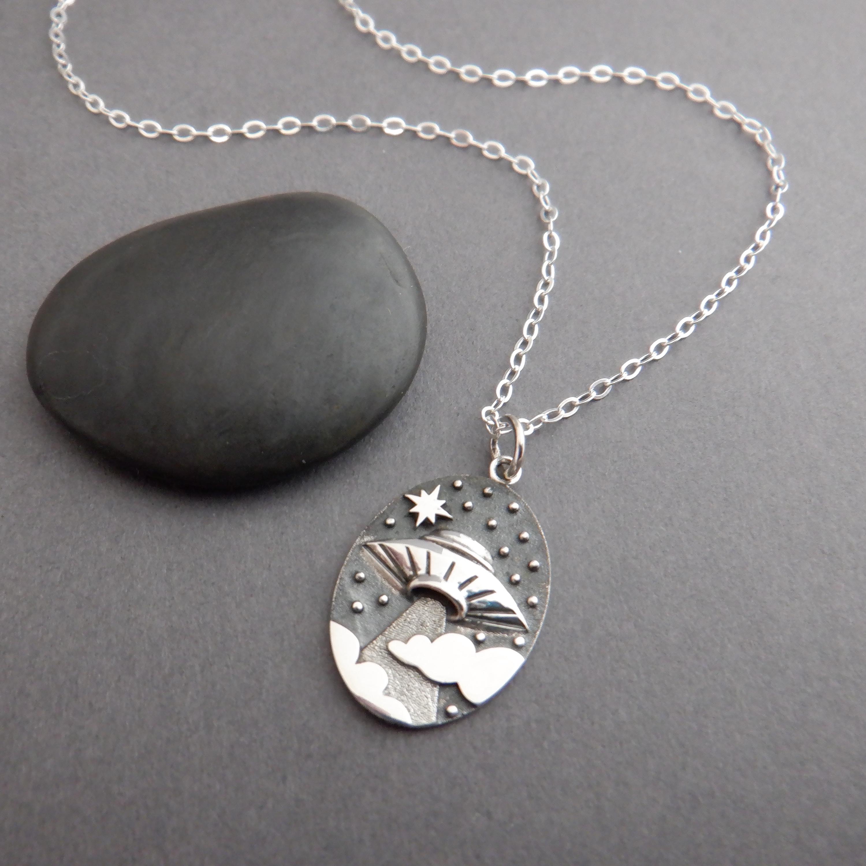 sterling silver ufo in clouds necklace. spaceship beaming light. outer space. alien science jewelry. quirky gift. scifi sci fi charm 3/4"