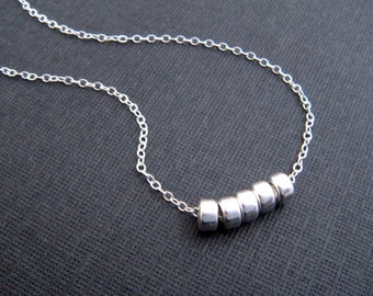 sterling silver 5 bead necklace. tiny everyday. small simple dainty delicate modern minimalist jewelry. beaded five donut beads. gift her