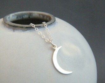small crescent moon necklace. sterling silver moon sliver charm. tiny celestial astrology delicate dainty pendant. simple everyday jewelry