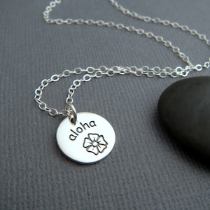 silver aloha necklace. small sterling flower charm. simple dainty delicate jewelry. word pendant. hello hawaii. hawaiian travel charm