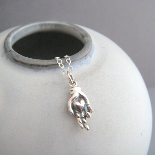 Sterling Silver Hand Holding Heart 