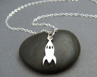 tiny silver rocket necklace. small sterling silver outer space pendant space launch alien science geekery jewelry quirky fun gift charm 1/2"