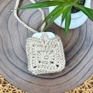Beige Crocheted Wireless earbud case, compatible with AirPods, measures 3 T 3 H .25 D, Granny Square Design