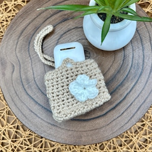 Beige Crocheted Wireless earbud case, compatible with AirPods, measures 3.25 W 2.75 H .5 D