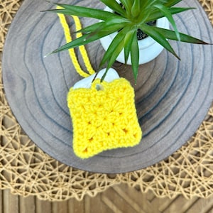 Yellow Crocheted Wireless earbud case, compatible with AirPods, measures 3 T 3 H .25 D, Pretty Granny Square Design