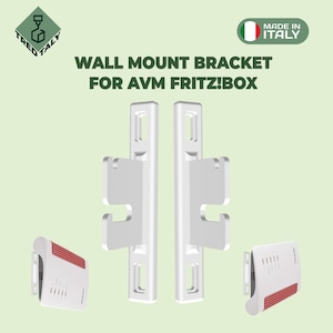 May include: White wall mount bracket for AVM Fritz!Box routers. The bracket is made in Italy and has two slots for mounting the router. The image shows the bracket with a router mounted on it.