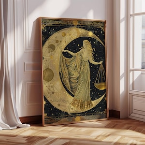 May include: A gold and black illustration of a woman standing on a crescent moon with a scale in her hand. The background is a dark blue with stars and planets.