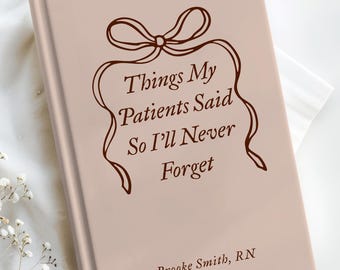 May include: A hardcover book with a light pink cover, featuring the text "Things My Patients Said So I'll Never Forget" in brown script. A decorative bow and ribbon design surrounds the text. The author's name, Brooke Smith, RN, is printed below.