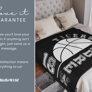 May include: Black blanket featuring a white basketball design, the word "TIGERS", the name "ANDRE", and the number "18". The blanket is on a bed with white pillows. The text "Love it GUARANTEE" is in the upper left corner.