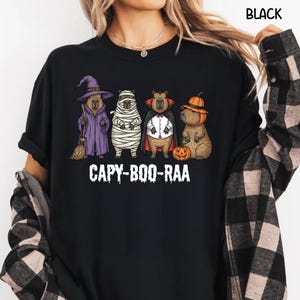 Celebrate spooky season in style with this Halloween Capybara Social Club shirt — perfect for anyone who loves retro vibes, chill capybara energy, and a touch of festive flair! Printed on ultra-soft Comfort Colors®, this Halloween t-shirt is a must-have for fall. Whether you’re rocking a spooky and cute look, a pumpkin capybara tee, or a playful ghost capybara vibe, this design blends cozy comfort with trendy social club style for the ultimate autumn statement.
