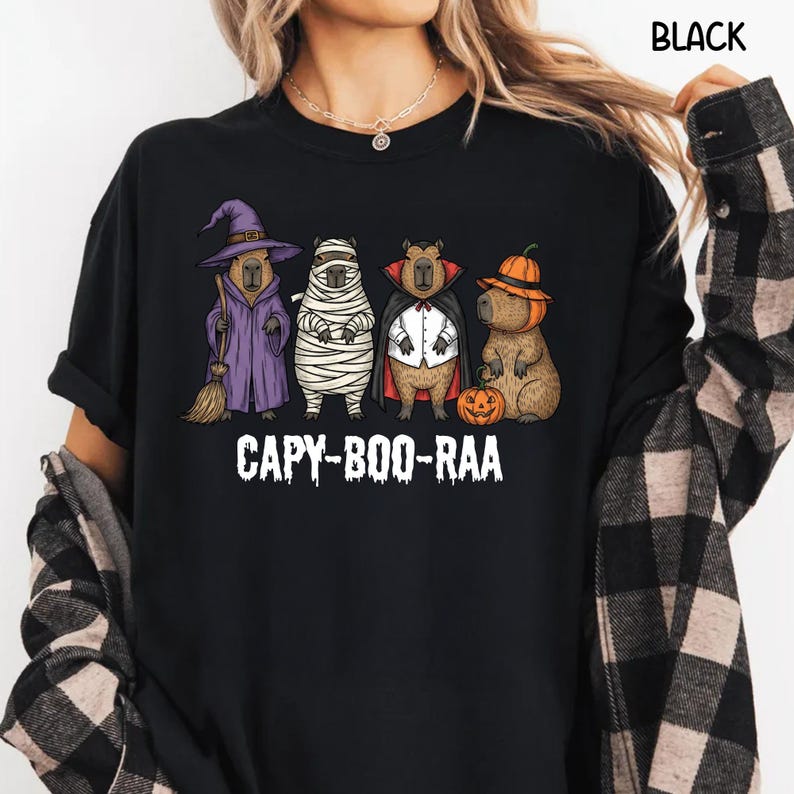 Celebrate spooky season in style with this Halloween Capybara Social Club shirt — perfect for anyone who loves retro vibes, chill capybara energy, and a touch of festive flair! Printed on ultra-soft Comfort Colors®, this Halloween t-shirt is a must-have for fall. Whether you’re rocking a spooky and cute look, a pumpkin capybara tee, or a playful ghost capybara vibe, this design blends cozy comfort with trendy social club style for the ultimate autumn statement.