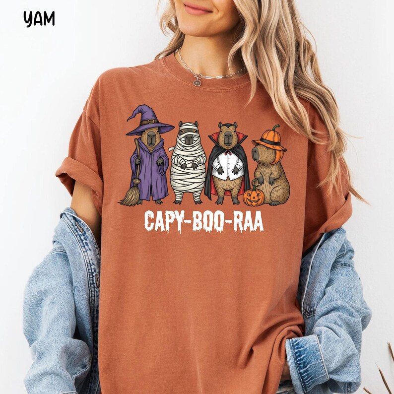 Celebrate spooky season in style with this Halloween Capybara Social Club shirt — perfect for anyone who loves retro vibes, chill capybara energy, and a touch of festive flair! Printed on ultra-soft Comfort Colors®, this Halloween t-shirt is a must-have for fall. Whether you’re rocking a spooky and cute look, a pumpkin capybara tee, or a playful ghost capybara vibe, this design blends cozy comfort with trendy social club style for the ultimate autumn statement.