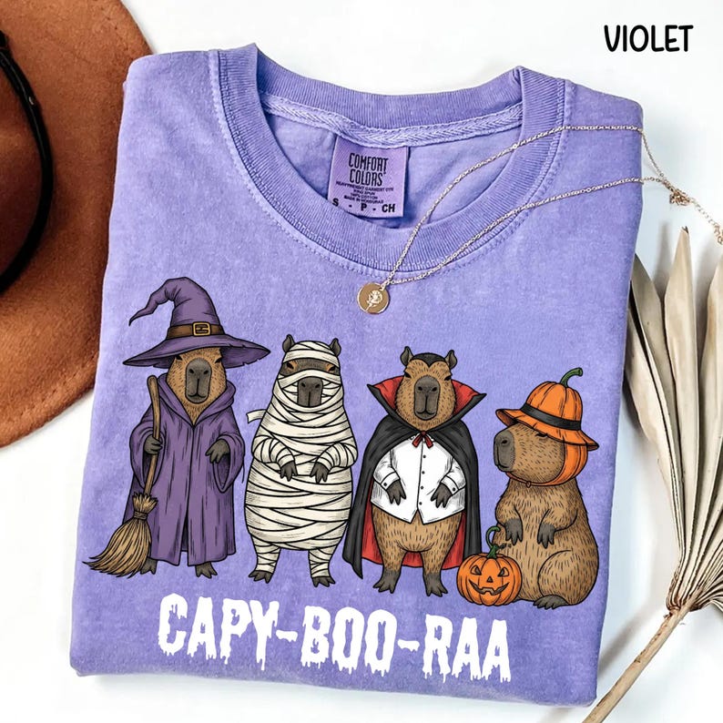 Celebrate spooky season in style with this Halloween Capybara Social Club shirt — perfect for anyone who loves retro vibes, chill capybara energy, and a touch of festive flair! Printed on ultra-soft Comfort Colors®, this Halloween t-shirt is a must-have for fall. Whether you’re rocking a spooky and cute look, a pumpkin capybara tee, or a playful ghost capybara vibe, this design blends cozy comfort with trendy social club style for the ultimate autumn statement.