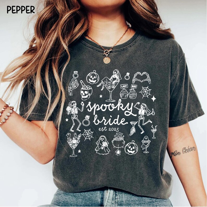 Get spooky in style with this Funny Halloween Bride Shirt — perfect for brides-to-be who love fall vibes and a little gothic glam! Printed on ultra-soft Comfort Colors®, it's ideal for bachelorette parties, Halloween-themed bridal showers, or showing off your spooky bride era. A must-have for future Mrs. who love skeletons, sass, and all things festive!