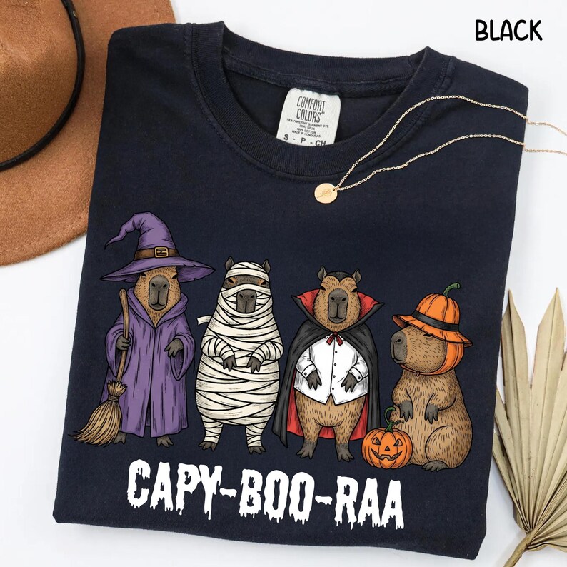 Celebrate spooky season in style with this Halloween Capybara Social Club shirt — perfect for anyone who loves retro vibes, chill capybara energy, and a touch of festive flair! Printed on ultra-soft Comfort Colors®, this Halloween t-shirt is a must-have for fall. Whether you’re rocking a spooky and cute look, a pumpkin capybara tee, or a playful ghost capybara vibe, this design blends cozy comfort with trendy social club style for the ultimate autumn statement.