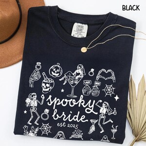 Get spooky in style with this Funny Halloween Bride Shirt — perfect for brides-to-be who love fall vibes and a little gothic glam! Printed on ultra-soft Comfort Colors®, it's ideal for bachelorette parties, Halloween-themed bridal showers, or showing off your spooky bride era. A must-have for future Mrs. who love skeletons, sass, and all things festive!