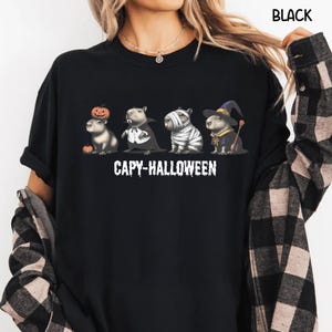 Celebrate spooky season in style with this Halloween Capybara Social Club shirt — perfect for anyone who loves retro vibes, chill capybara energy, and a touch of festive flair! Printed on ultra-soft Comfort Colors®, this Halloween t-shirt is a must-have for fall. Whether you’re rocking a spooky and cute look, a pumpkin capybara tee, or a playful ghost capybara vibe, this design blends cozy comfort with trendy social club style for the ultimate autumn statement.