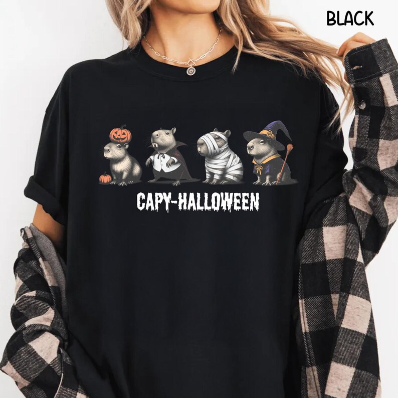 Celebrate spooky season in style with this Halloween Capybara Social Club shirt — perfect for anyone who loves retro vibes, chill capybara energy, and a touch of festive flair! Printed on ultra-soft Comfort Colors®, this Halloween t-shirt is a must-have for fall. Whether you’re rocking a spooky and cute look, a pumpkin capybara tee, or a playful ghost capybara vibe, this design blends cozy comfort with trendy social club style for the ultimate autumn statement.