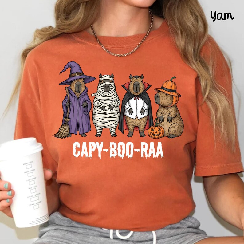 Celebrate spooky season in style with this Halloween Capybara Social Club shirt — perfect for anyone who loves retro vibes, chill capybara energy, and a touch of festive flair! Printed on ultra-soft Comfort Colors®, this Halloween t-shirt is a must-have for fall. Whether you’re rocking a spooky and cute look, a pumpkin capybara tee, or a playful ghost capybara vibe, this design blends cozy comfort with trendy social club style for the ultimate autumn statement.