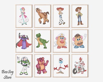 May include: Twelve framed prints featuring watercolor illustrations of characters from the animated movie Toy Story. The characters include Woody, Buzz Lightyear, and Mr. Potato Head. The prints are displayed on a white background.