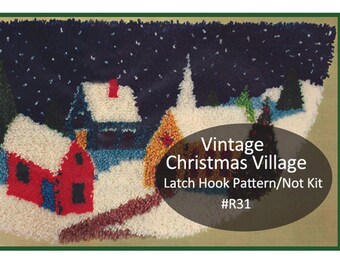 May include: Vintage Christmas Village latch hook pattern, not a kit. The pattern features a snowy village scene with houses, trees, and a church under a starry night sky. The pattern number is #R31.
