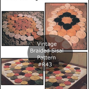 May include: Vintage braided sisal rug pattern #R43. The rug is made of braided sisal rope and has a circular design with a variety of colors, including brown, black, white, red, and yellow.