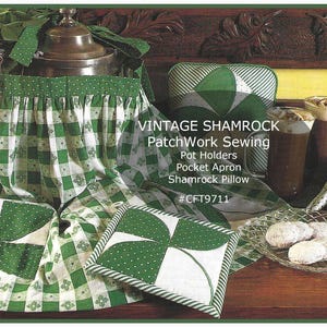 May include: A green and white patchwork sewing pattern featuring a shamrock design. The pattern includes instructions for making pot holders, a pocket apron, and a shamrock pillow. The pattern is titled "Vintage Shamrock Patchwork Sewing #CFT9711".