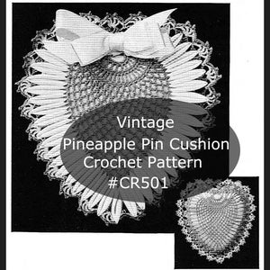 May include: Vintage crochet pattern for a pineapple pin cushion. The pattern is called "Pineapple Pin Cushion Crochet Pattern #CR501". The image shows a close-up of the finished pin cushion, which is made of white crochet thread and has a bow on top.