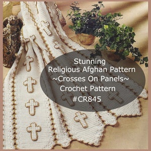May include: White crochet afghan with a gold cross pattern. The pattern is called "Crosses On Panels" and the crochet pattern number is #CR845.
