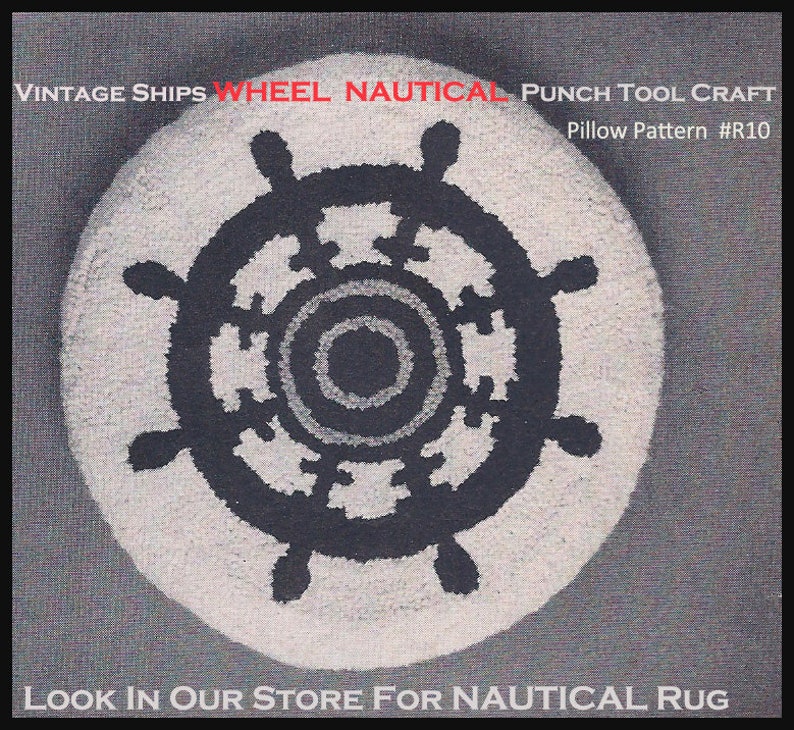 May include: Circular, cream-coloured cushion featuring a navy blue ship's wheel design. The nautical-themed punch tool craft has text that reads "Vintage Ships Wheel Nautical" and "Pillow Pattern #R10".