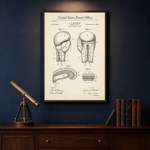 May include: Framed vintage boxing glove patent print. The print features detailed illustrations of boxing gloves, including front and side views, and a cross-section. The text "United States Patent Office" is at the top. The print is in a black frame.