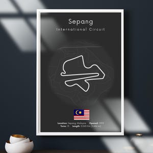 May include: A framed poster featuring the Sepang International Circuit track layout in white on a dark gray background. The text "Sepang International Circuit" is at the top. Includes the Malaysian flag and track details: 15 turns, 5.543 km length.