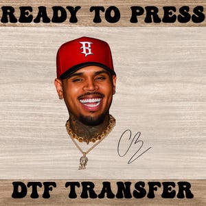 May include: DTF transfer featuring a smiling man wearing a red baseball cap with a white "B" logo. He has a gold chain and pendant, with the initials "CB" in a signature style. The words "READY TO PRESS" and "DTF TRANSFER" are at the top and bottom.